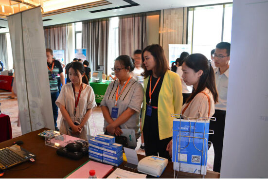 Visitors at the ZC Bioscience exhibition table